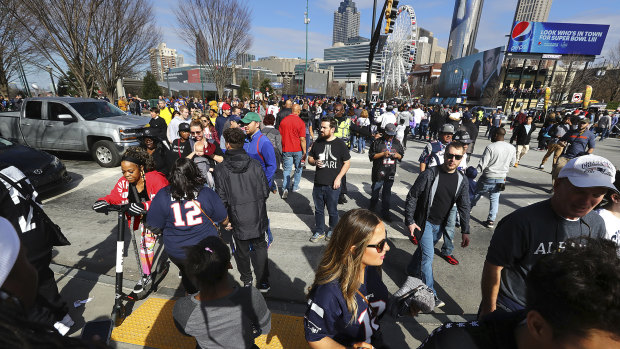 Fever pitch: Fans gather in Atlanta the day before Super Bowl LII.