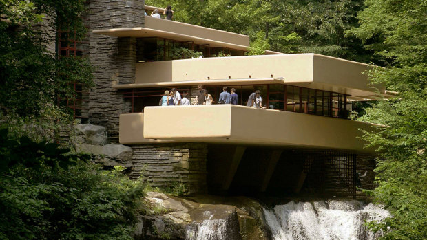 Visitors gather on one of the cantilevered terraces at Fallingwater, a Frank Lloyd Wright design in Bear Run, Pennsylvania.