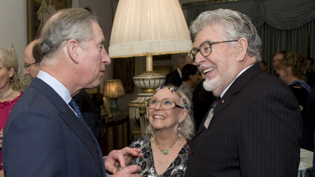 Rolf Harris meets King Charles III, then the Prince of Wales, in 2009.