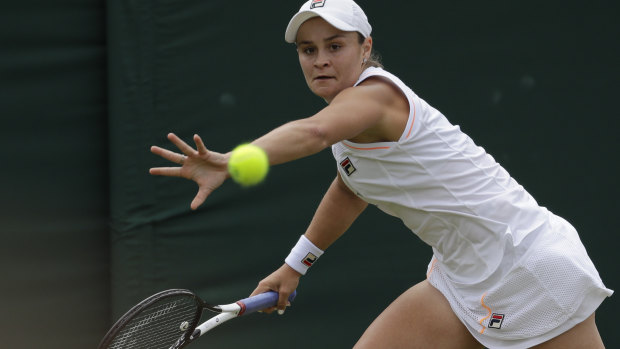Ash Barty returns to her opponent.