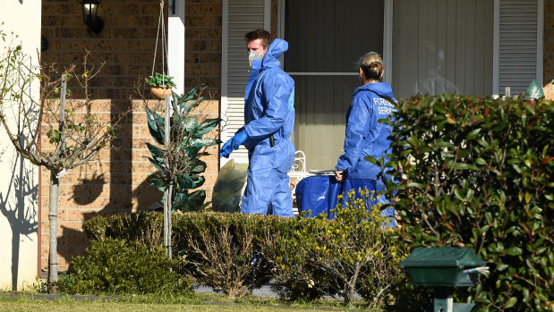 Police at the crime scene on Sunday.