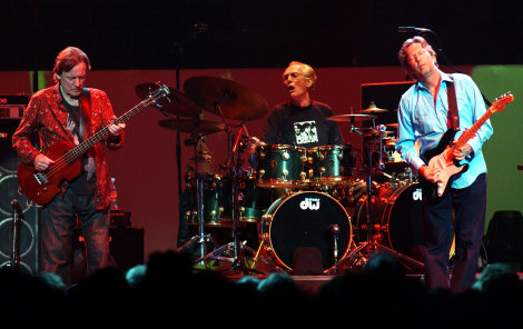 Legendary rock group Cream, from left, Jack Bruce, Ginger Baker and Eric Clapton, perform live on the first night of their reunion at the Royal Albert Hall in London in 2005.