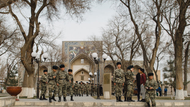 Soldiers walk during their day off at the center of Bukhara, Uzbekistan.