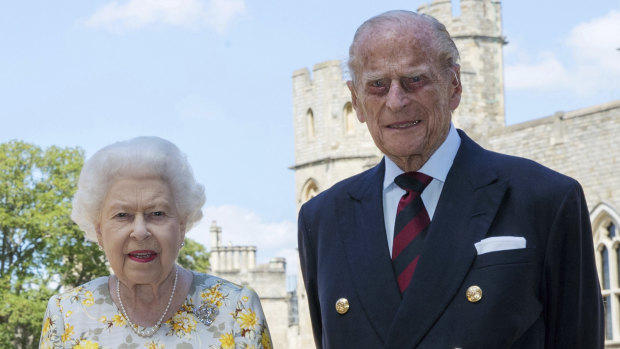 The Queen and Prince Philip pose for a photo in the quadrangle of Windsor Castle.