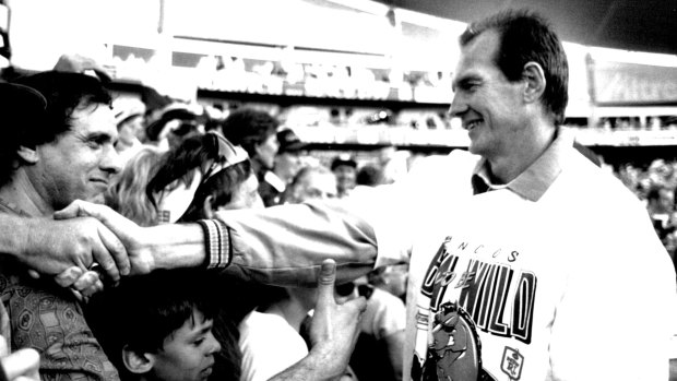Brisbane coach Wayne Bennett greets fans after the Broncos' 1993 grand final win at the Sydney Football Stadium. 