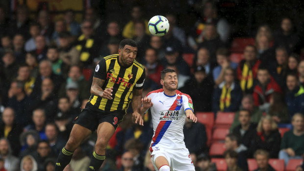 Watford's Troy Deeney and Crystal Palace's Joel Ward vie for the ball at Vicarage Road on Sunday.