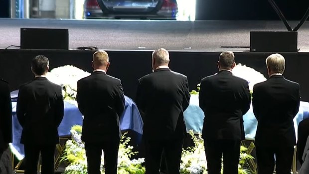 The coffins of constables Rachel McCrow and Matthew Arnold at the police memorial service in Brisbane.
