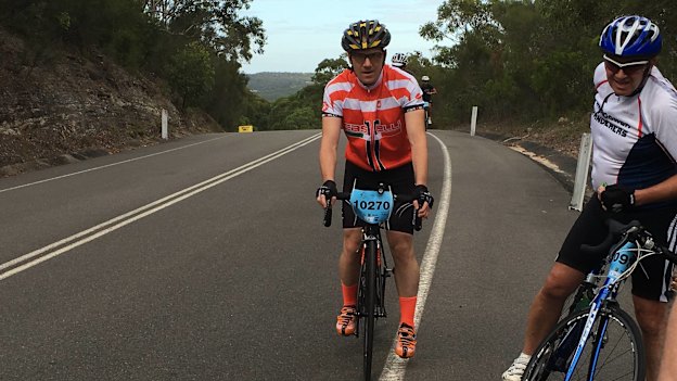 Peteris (in red) climbing a hill during Sydney's Bobbin Hill Classic Bike Ride in April 2016. Only four months later, the first symptoms of MND appeared. 