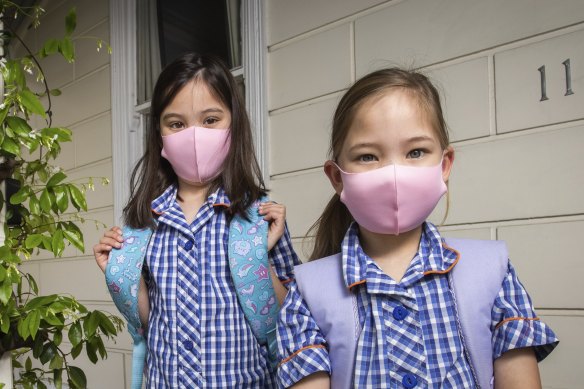 Grace and Sarah say they don’t mind wearing masks, but they found their first day at school exhausting.
