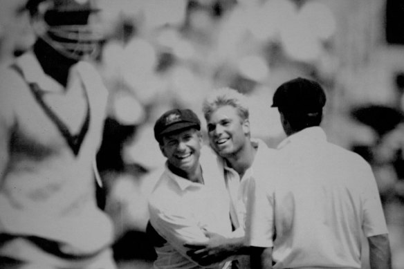 Shane Warne is congratulated by keeper Ian Healy after collecting his sixth victim, Ian Bishop. December 30, 1992.