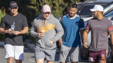 Casual approach: Brisbane Broncos players David Fifita, Matt Lodge, Payne Haas and Joe Ofahengaue arrive at the Clive Berghofer Centre for an apparent crisis meeting.