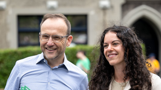 Federal Greens leader Adam Bandt and Greens candidate Angelica Di Camillo hand out how-to-vote cards in South Yarra on Saturday morning.