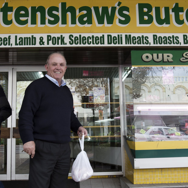 John Williams outside the local butcher shop and his electoral office in Inverell in 2014. 