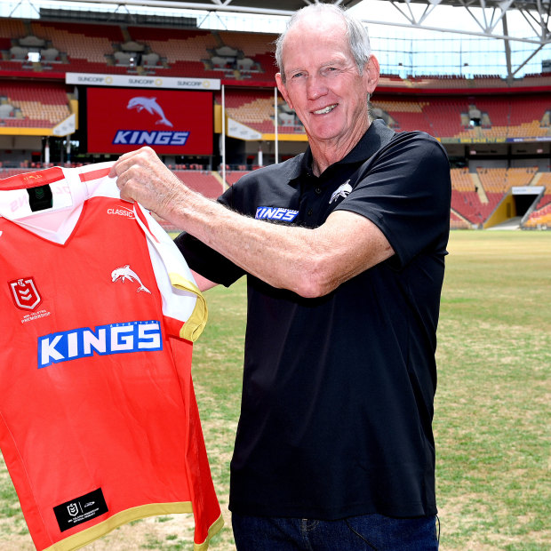 Wayne Bennett with the new jersey to be worn by the Dolphins.