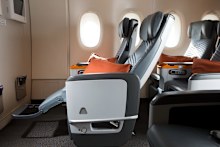 A Singapore Airlines premium economy seat comes with calf and footrests and a generous recline. Book the Cook meals are available.