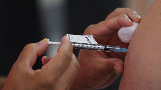 Economists warn the cost of delays in Australia’s vaccination rollout will be “very significant”