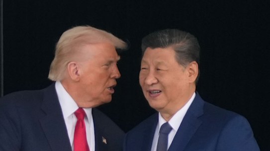 Trump, and Xi shake hands.