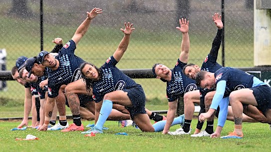 Blues players warm-up during their session in Kingscliff on Wednesday.
