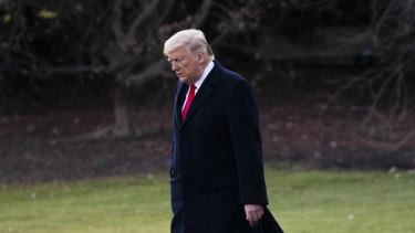 US President Donald Trump walks on the South Lawn of the White House before departing.
