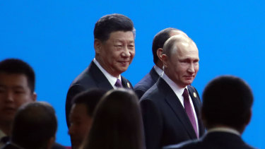 Xi Jinping and Russian President Vladimir Putin arrive for the opening ceremony of the second Belt and Road Forum for International Co-operation in Beijing on Friday.