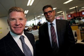 Andrew Demetriou at the offices of Acquire Learning with former managing director John Wall. 