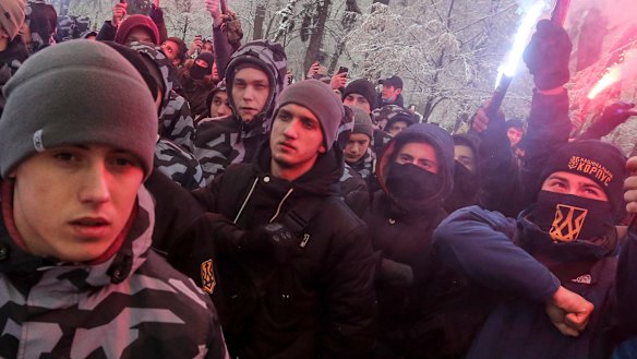 Volunteers with the right-wing paramilitary Azov National Corps rally in front of the Ukrainian parliament.