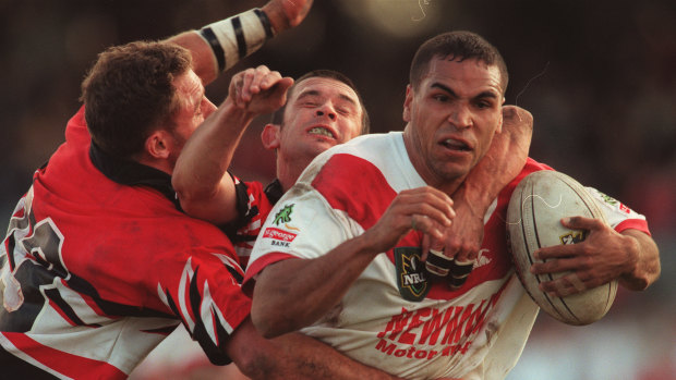 League of his own: Mundine in action for the Dragons against Norths in 1998.