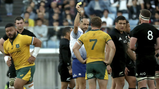 Marched: Tolu Latu is sent off against the All Blacks in Yokohama. The Wallabies will be hoping for better discipline from the hooker against Wales.