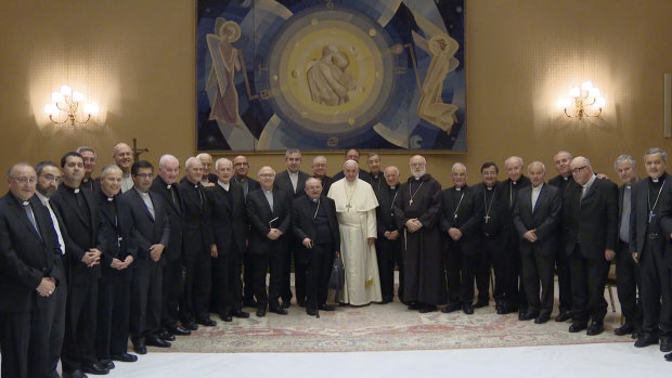 Pope Francis, centre, poses for a picture with Chilean bishops summoned to a meeting at the Vatican in May. All 28 offered to resign.