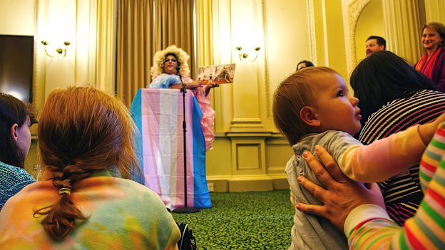 Drag queen Frock Hudson reads for young children and their families at Parliament House on Wednesday.