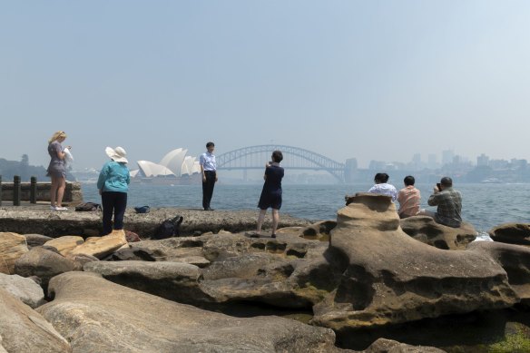 Smoke haze settles over Sydney Harbour on Tuesday. 