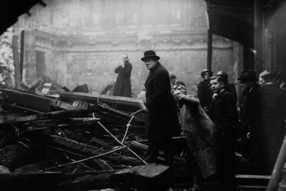 British prime minister Winston Churchill and his wife inspect  London during the Blitz in 1940.