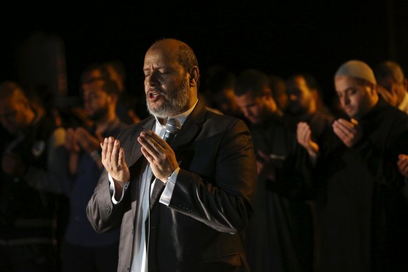 Hamas leader Khalil al-Hayya leads a prayer during a protest near the Israeli border in 2018.