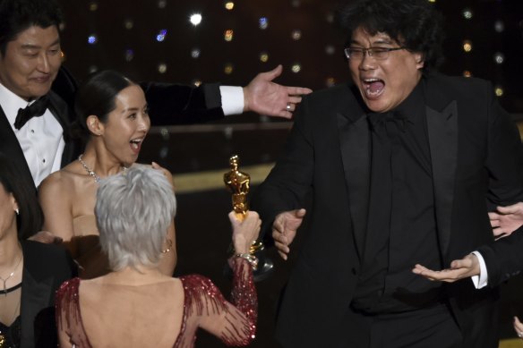 Bong Joon Ho (right) is presented with the award for best picture for Parasite from presenter Jane Fonda.