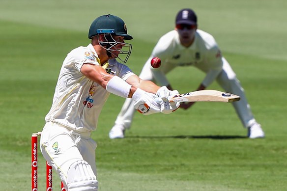 David Warner looks to play a shot outside off stump on day two at the Gabba.
