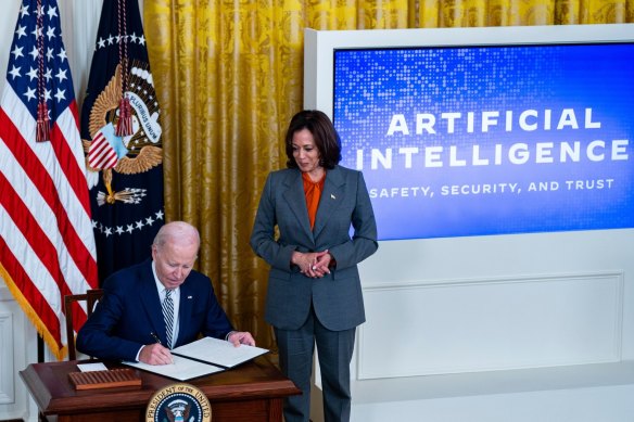 US President Joe Biden, with Vice President Kamala Harris, as he signed the executive order on Monday.