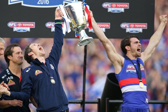 Former captains Easton Wood (right) and Bob Murphy roar after the Dogs' 2016 flag 