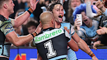 Nicho Hynes celebrates a try.