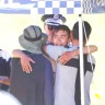 Rescued hiker Hadi Nazari, 23, embraces loved ones on Wednesday.