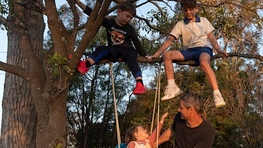 Mark Trowell at home with Oliver, 9; Charlie, 5; and Gracie, 2.