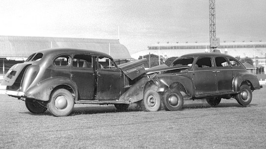 Metal juggernauts: Demonstrating the benefits of wearing safety belts in a car crash, Sydney Showground, 1963.