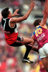 Nicky Winmar flies.