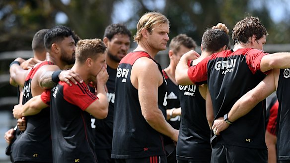 Crusaders coach Scott Robertson (centre) along with players on Friday at Scots College. 