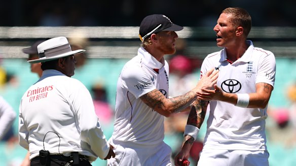 Stokes pushes away Carse before having words with the on-field umpire.