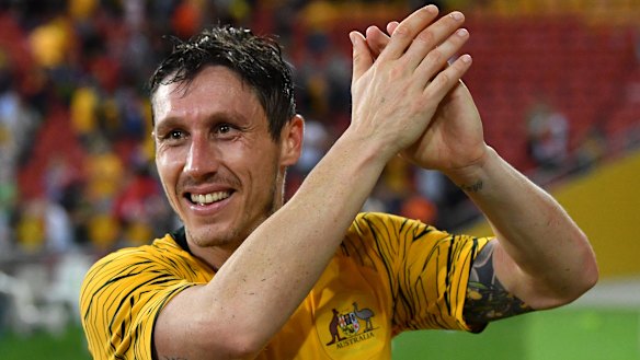 Proud moment: Mark Milligan thanks the Brisbane crowd after the Socceroos snatched a draw against South Korea.