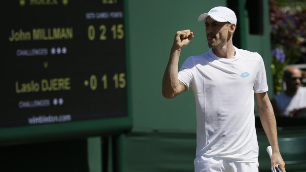 Untroubled: John Millman has joined fellow Australian Ash Barty in the third round of Wimbledon.