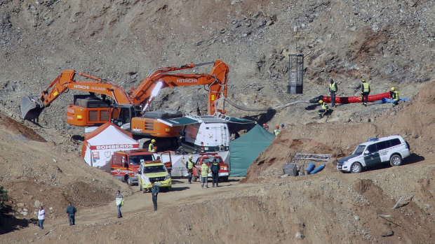 Drill and excavating machinery work next to a deep borehole to reach a two-year-old boy trapped for 12 days near the town of Totalan in Spain. 