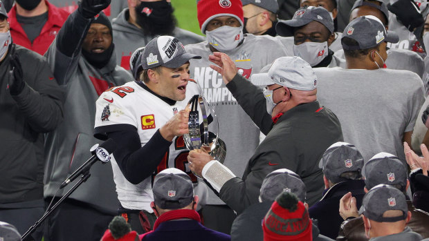 Tom Brady and Tampa Bay Buccaneers head coach Bruce Arians celebrate sealing their place in the Super Bowl with victory over the Packers.