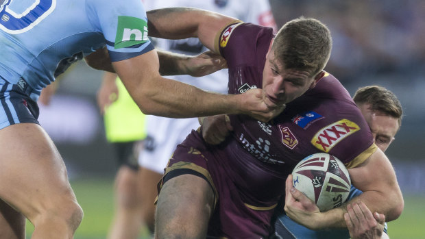 Jai Arrow of the Maroons is tackled during Game 2 in 2018.