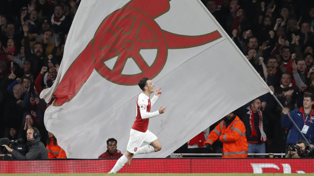 Mesu Ozil celebrates scoring Arsenal's opener.